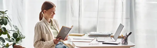Happy Teenager Reading Book Sitting Laptop Desk Online Education Horizontal — Stock Photo, Image