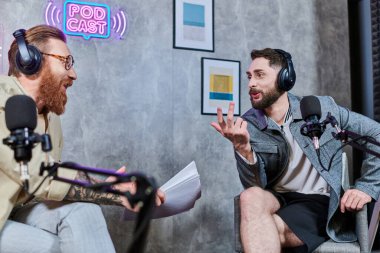 attractive interviewer with red hair and his guest with headphones discussing questions, podcast clipart