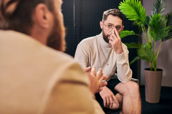 stock image dedicated elegant men in debonair clothes sitting and discussing interview questions in studio