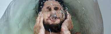 frustrated depressed man drowning in bathtub during breakdown, mental health awareness, banner clipart