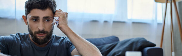 anxious man in casual homewear with beard suffering from breakdown, mental health awareness, banner