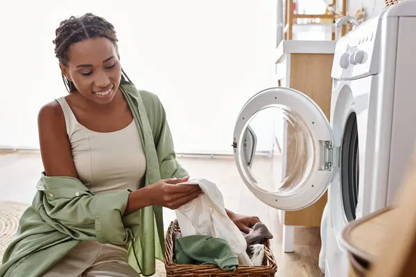 African American Woman Afro Braids Sitting Next Washing Machine Doing — Stock Photo, Image
