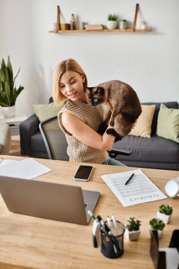 A stunning woman with short hair is bonding with a cat on her shoulder at home. clipart