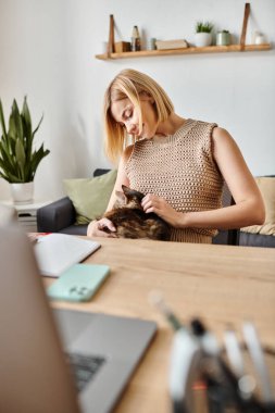 A woman with short hair is peacefully sitting at a table, gently petting her beloved cat in a cozy home setting. clipart