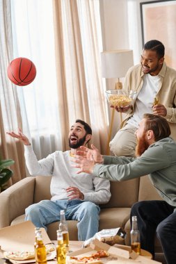 Three cheerful, interracial men in casual attire play a competitive game of basketball, showcasing friendship and teamwork. clipart