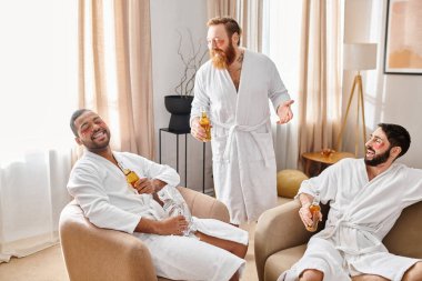 Three diverse, cheerful men in bathrobes, enjoying each others company while sitting together in a cozy living room. clipart