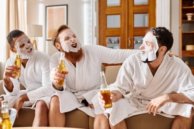 Three diverse, cheerful men in bathrobes relax happily perched on a couch, sharing a moment of friendship and joy. clipart