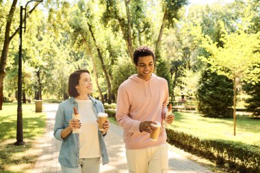 A diverse loving couple in vibrant attires walk down a sidewalk, enjoying each others company. clipart