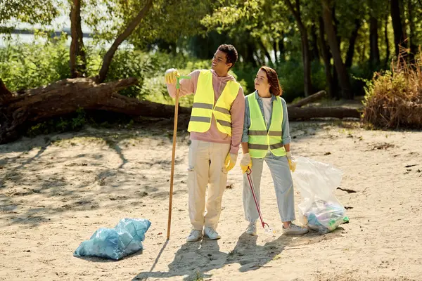 Man Woman Diverse Loving Couple Walk Sandy Beach Cleaning Tools —  Fotos de Stock