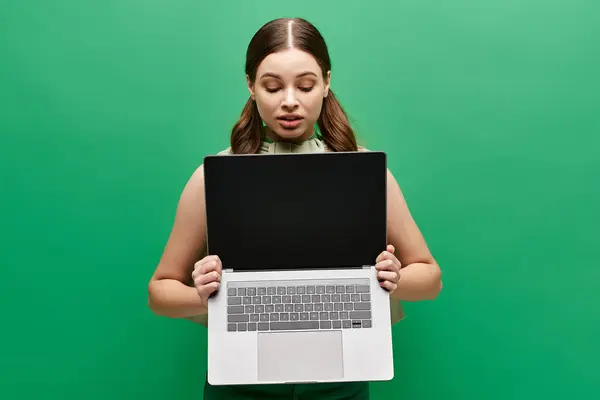 Young Woman Her 20S Holds Laptop Front Her Face Concealing — Stock Photo, Image