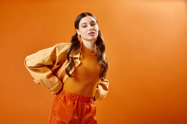 Fashionable Young Woman Her 20S Poses Confidently Stylish Orange Outfit Stock Picture
