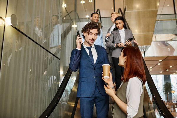 A man in a blue suit engaged in conversation on a cell phone.