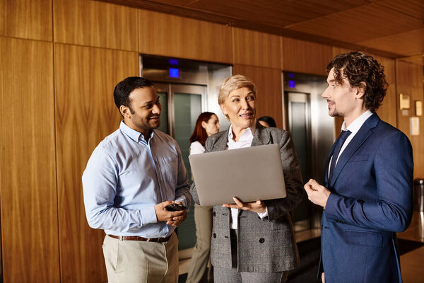 Multiracial group of business people talking in a room.