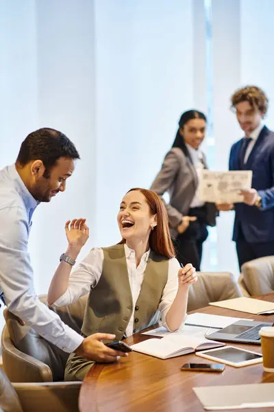 stock image Multicultural professionals collaborate at a conference table.