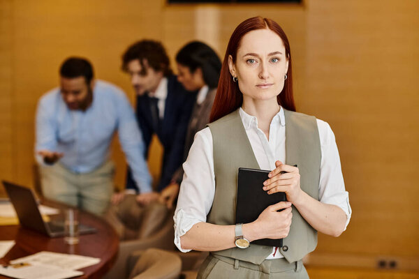 A woman leading an interracial group of business people.