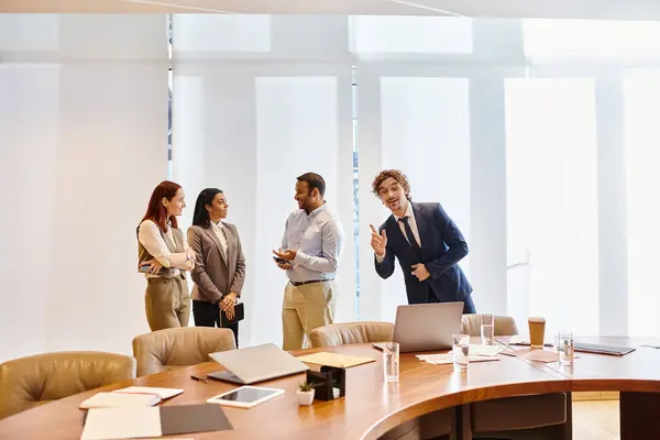 stock image Diverse business professionals brainstorming around a conference table.