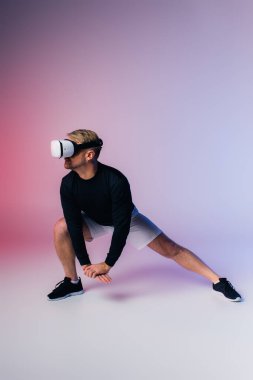 A stylish man in a black shirt and white shorts poses in a studio setting, virtual reality clipart