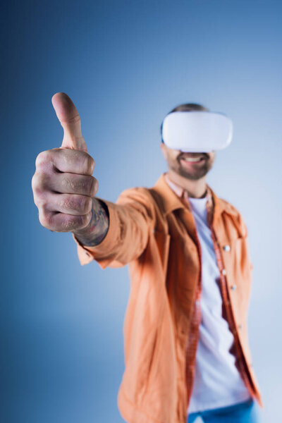 A man in an orange jacket wears a white blindfold in a studio, immersed in the virtual world of the Metaverse.