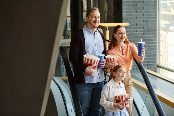 Family Stand Escalator Holding Cups Popcorn Enjoying Outing Cinema — Stock Photo, Image