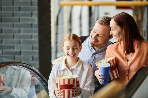 Family Holding Popcorn Buckets While Standing Next Escalator Cinema — Stock Photo, Image