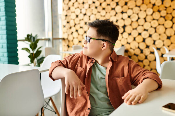 joyous preadolescent inclusive boy with Down syndrome in casual attire looking away while in cafe