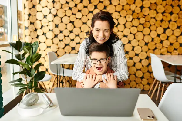 Beautiful Joyous Mother Looking Laptop Her Inclusive Cute Son Syndrome Stock Picture