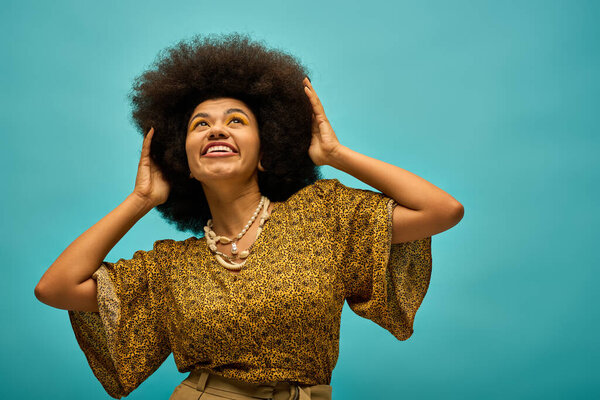 A stylish African American woman embraces her afro with vibrant energy.