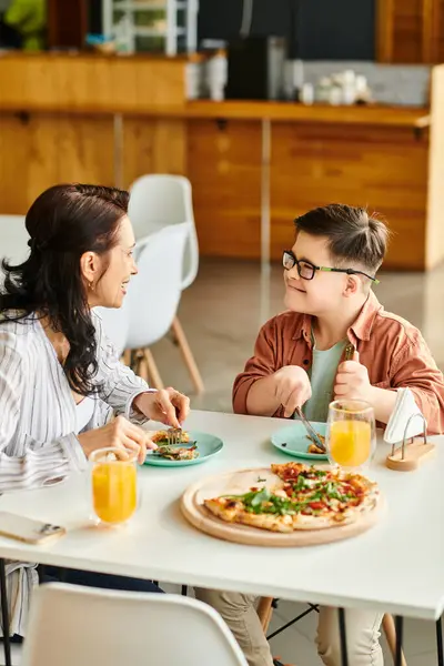 Jolly Mother Eating Pizza Drinking Juice Her Inclusive Cute Son Stock Picture