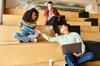 Multicultural students of various backgrounds engaging in conversation while sitting on steps clipart