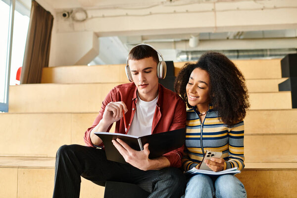 A man and a woman, holding a book, sit closely on a bench, engaged in reading and deep conversation