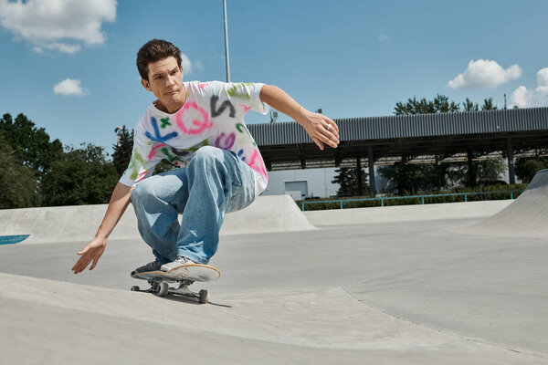A young skater boy confidently rides his skateboard down the side of a ramp in a sunny outdoor skate park.