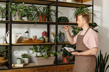 A man standing proudly amidst a lush collection of potted plants in his small business florist shop. clipart