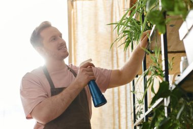 A man holds a blue spray bottle in front of a vibrant plant, enhancing its growth in a surreal garden setting. clipart