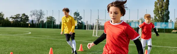 A group of young people, full of energy and enthusiasm, engaged in a friendly game of soccer. They are running, passing, and kicking the ball, showcasing their skills and teamwork.