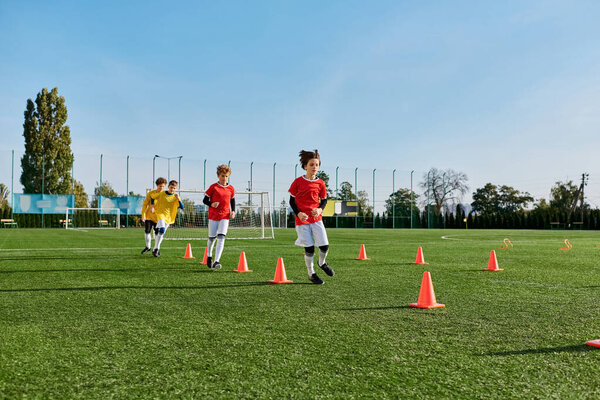 A group of young men stands proudly on the top of a soccer field, smiling and high-fiving each other after a successful game. The grassy field stretches beneath them as they celebrate their victory.