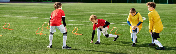 A group of young men, filled with determination and pride, stand together on top of a soccer field after a hard-fought game, celebrating their victory.