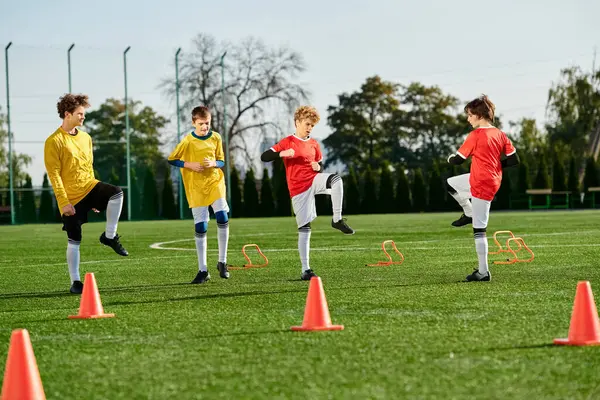A group of young boys with vibrant energy kick around a soccer ball on a grassy field, laughing and competing in a friendly game.