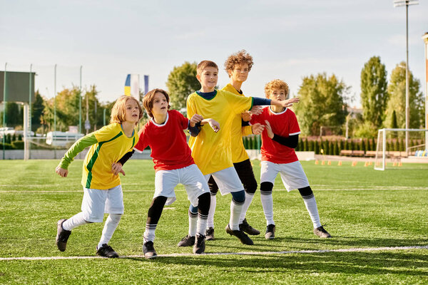 A lively group of children is playing a friendly game of soccer. Excited shouts fill the air as they chase after the ball, passing and shooting with enthusiasm. The field is a flurry of movement and laughter as they display teamwork and sportsmanship
