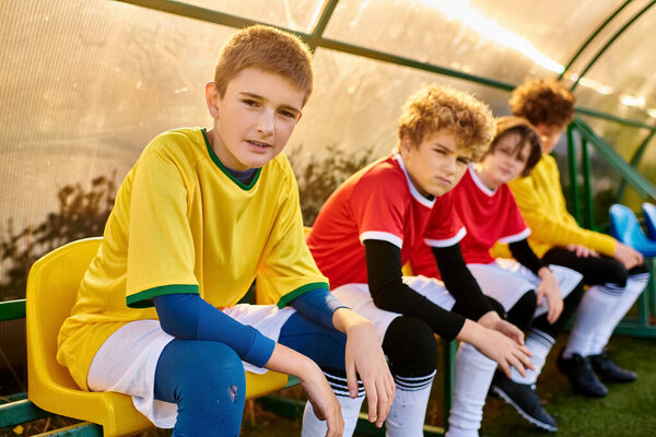 A tight-knit group of young men sitting closely together, conversing and laughing. Their camaraderie is evident as they share stories and jokes, creating a warm and vibrant atmosphere.