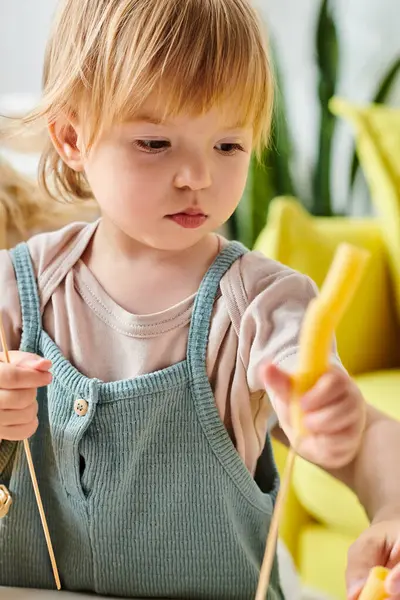 Little Girl Holding Dry Pasta Exploring Sensory Game — Fotografia de Stock