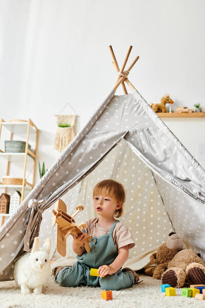 A little girl sits in awe in front of a teepee tent, her eyes wide with wonder, ready to embark on a magical adventure.