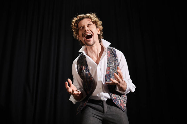 A stylish man in white shirt and black pants performing gracefully.