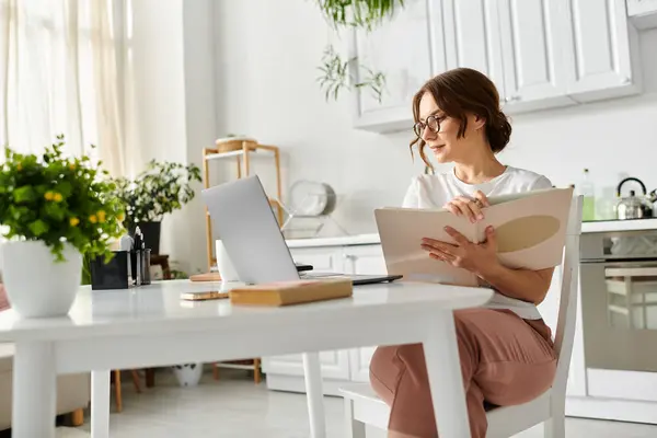 Middle Aged Woman Sits Table Engrossed Her Laptop — Stock Photo, Image
