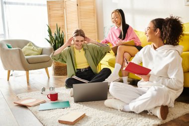 Diverse group of teenage girls studying joyfully on top of a striking yellow couch, fostering friendship and education. clipart