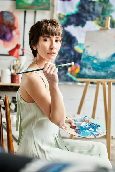 Woman Sits Painting Brush Hand — Stock Photo, Image