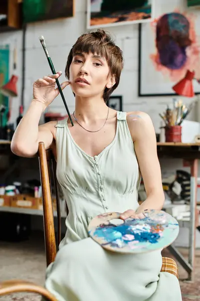 Woman Creates Magic Paintbrush While Seated Chair — Stock Photo, Image