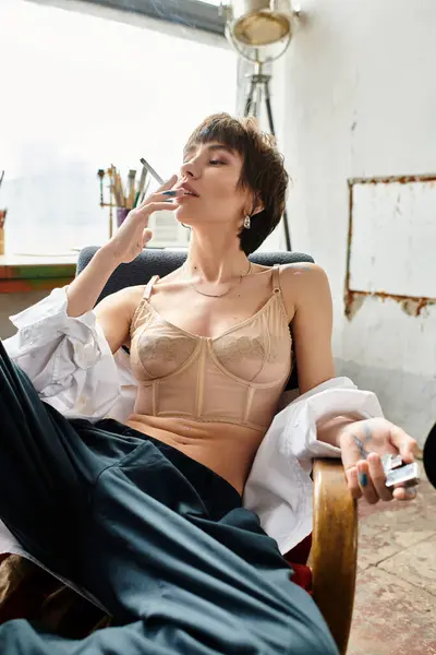 Stylish Woman Sitting Chair Smoking Cigarette Thoughtful Expression — Stock Photo, Image