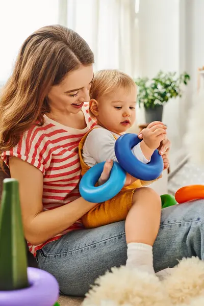 Young Mother Sits Floor Affectionately Holding Her Toddler Daughter Her — Stock Photo, Image