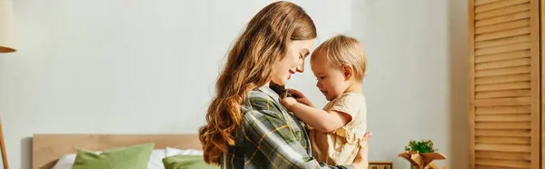 Young Mother Lovingly Holds Her Toddler Daughter Close Her Arms — Stock Photo, Image