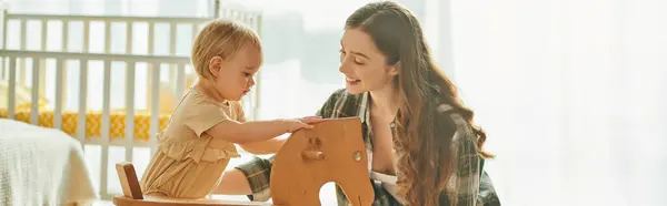 Young Mother Her Toddler Daughter Playing Wooden Chair Pretending Its — Stock Photo, Image